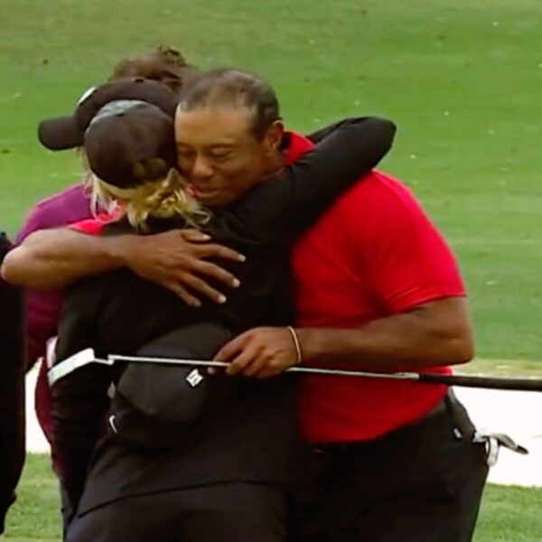Tiger Woods and Izzi Stricker embrace a hug after concluding PNC Championship