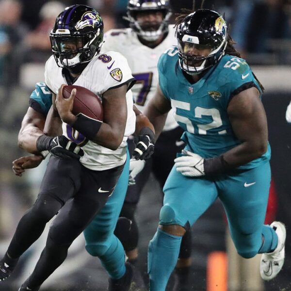 Ravens clinch playoff berth behind Lamar Jackson, stifling protection in win over…