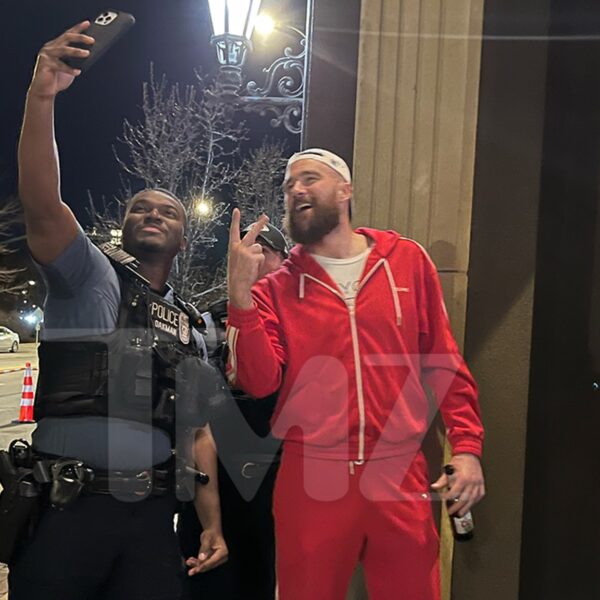 Travis Kelce Takes Photograph at Restaurant with Cop After Kansas Metropolis Parade…