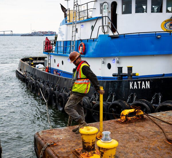 Crews at Website of Bridge Collapse Work on Eradicating First Piece of…