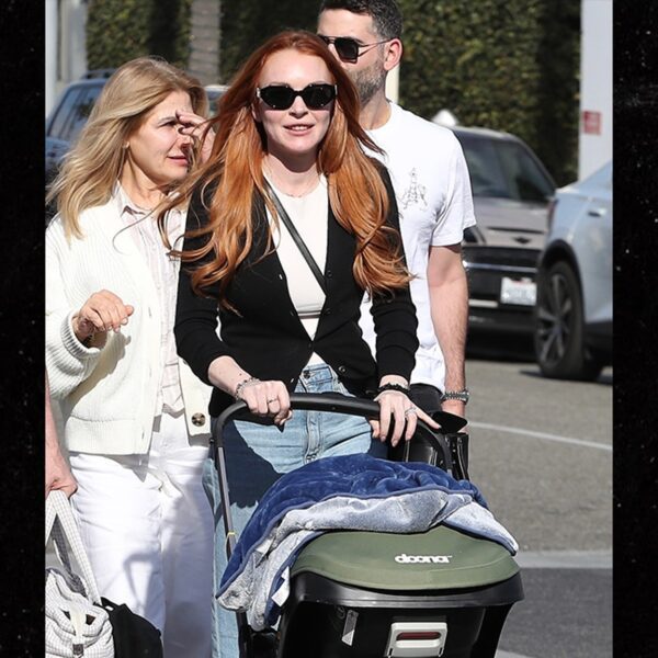 Lindsay Lohan Pushes Child Stroller with Husband in Beverly Hills