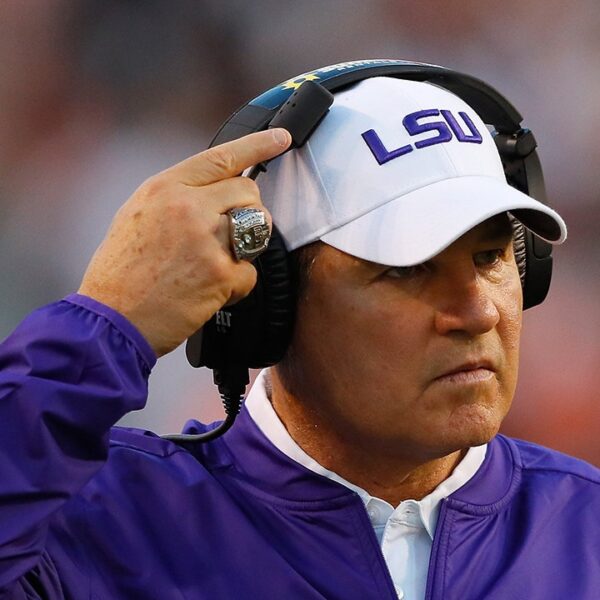 Former LSU coach Les Miles sues college, claims vacated wins conserving him…