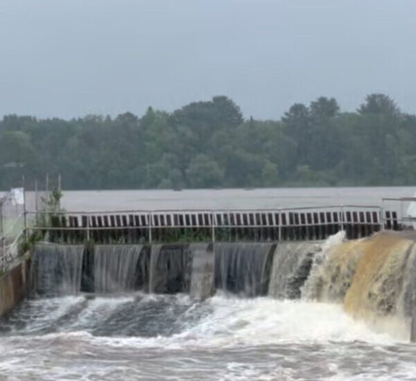 River Surges Over Wisconsin Dam Amid Heavy Rain, Imperiling Small City