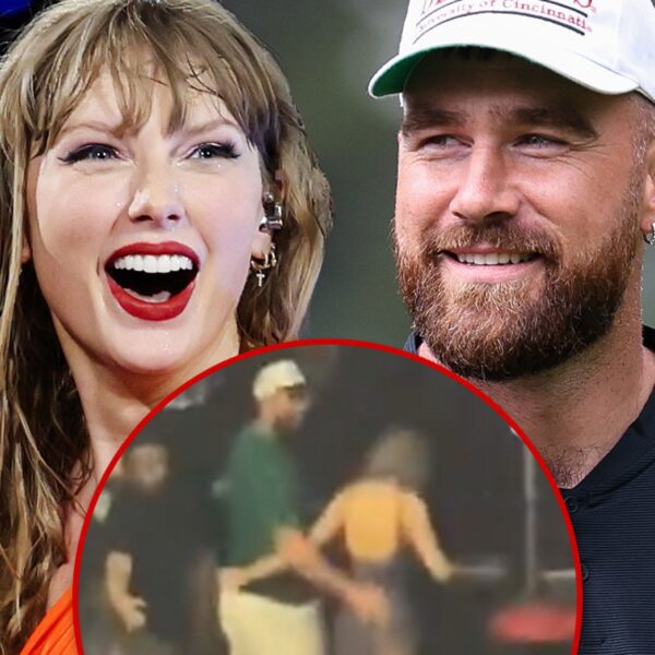 Travis Kelce Wraps Arm Around Taylor Swift’s Waist After ‘Eras’ Show in…