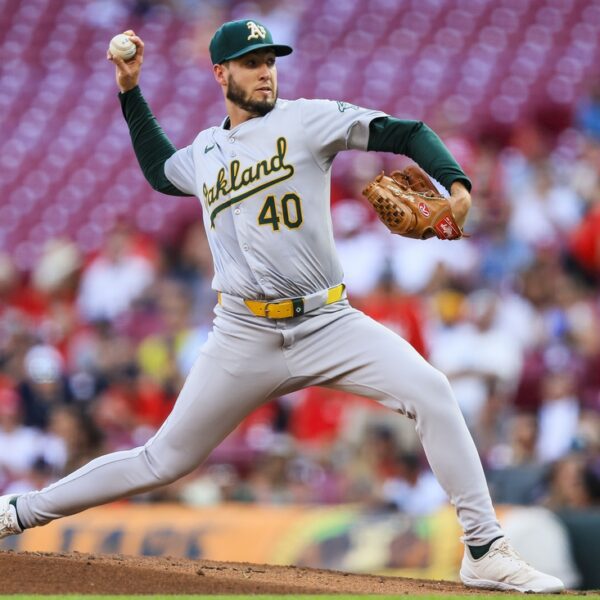 A’s go deep twice in seventh, narrowly fend off Reds