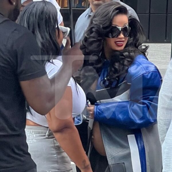 Cardi B Covered Up By Lots of Umbrellas While Stepping Out in…