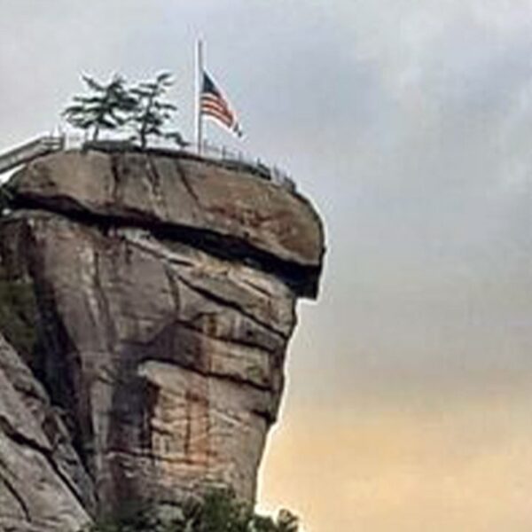 American flag stands sturdy after vacationer city leveled by remnants of Hurricane…