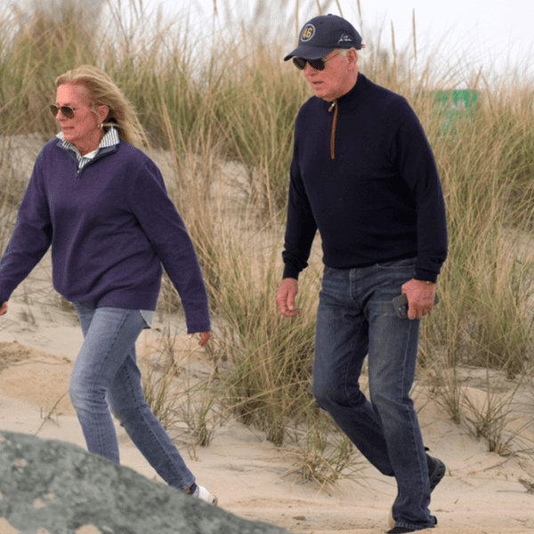 Biden seems to wrestle whereas strolling on Delaware seaside with first girl