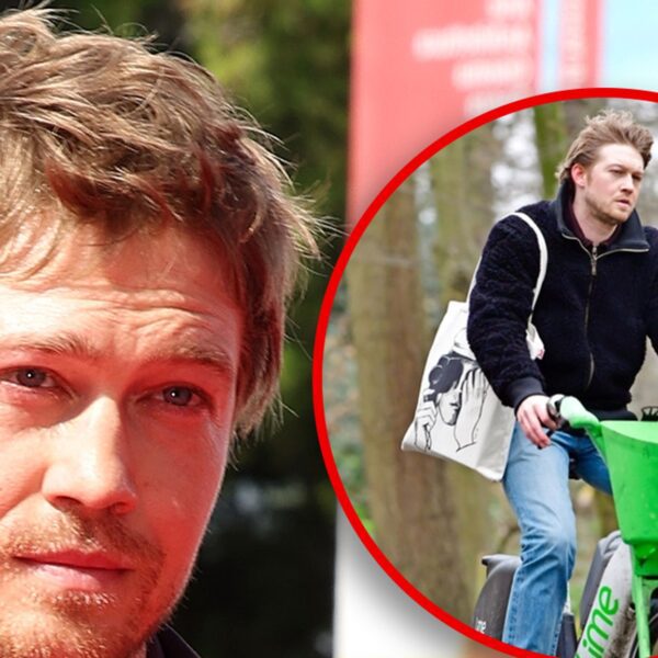 Joe Alwyn Looks Downcast Riding Bike the Day After Christmas in London