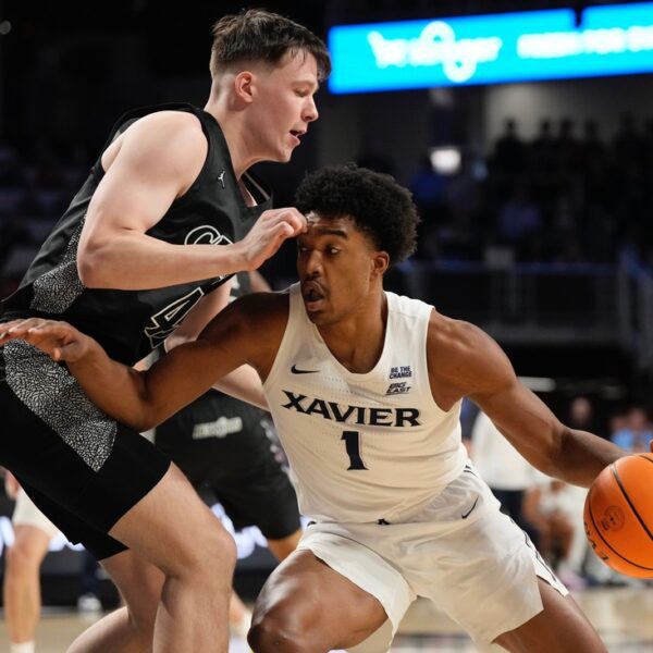 No. 22 Cincinnati roars again late to upend rival Xavier