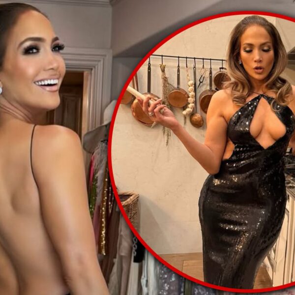 Jennifer Lopez Struts her Stuff in Tight-Fitting Gown on Video