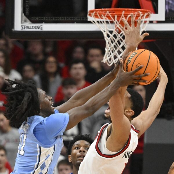 Louisville fends off a number of comeback bids by North Carolina