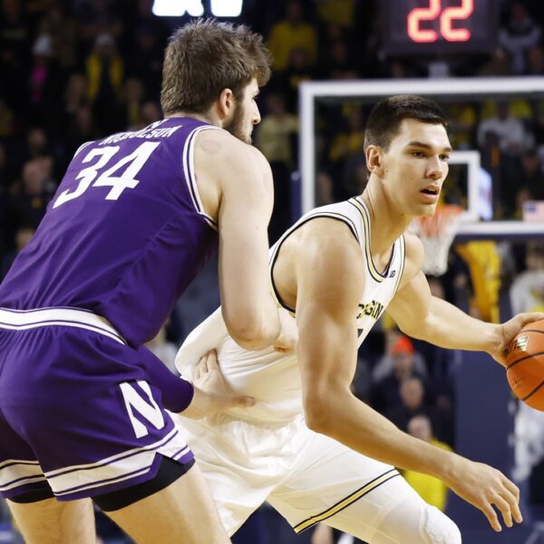 No. 20 Michigan fends off Northwestern in OT