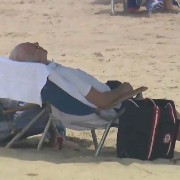 Biden Seen on Beach Struggling with Chair During First 4th of July…