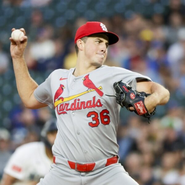 After tweak sparks win, Reds proceed playoff push vs. Cardinals