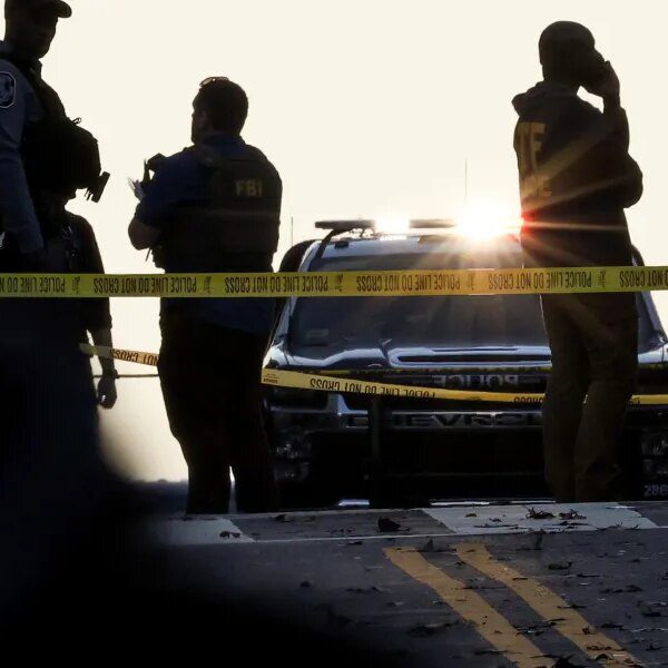 Trump orders new immigration curbs as FBI probes guard taking pictures