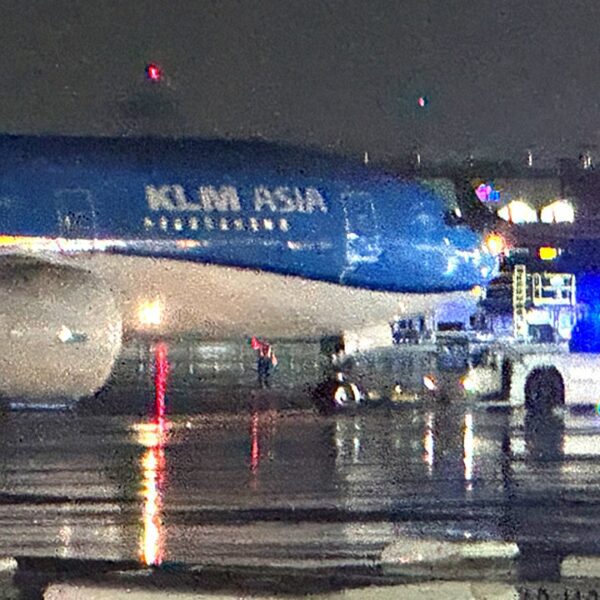 Passenger accused of opening emergency exit door on flight, deploying slide