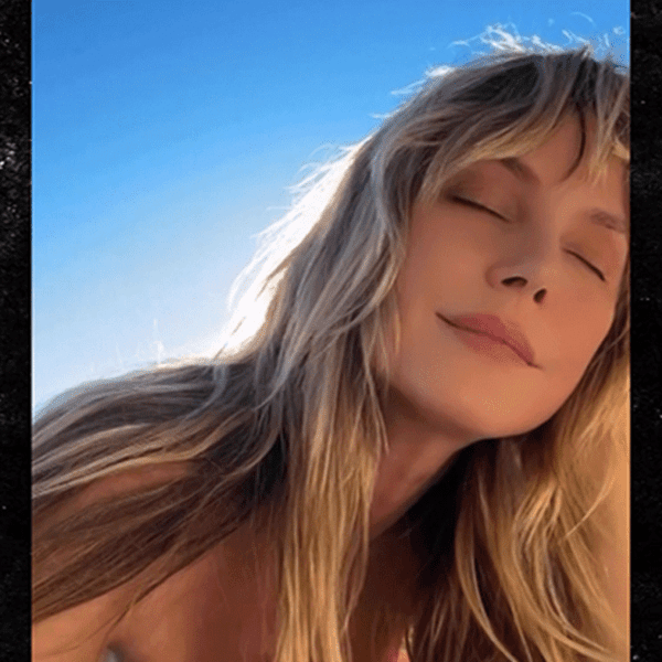 Heidi Klum Tans Topless, on Video