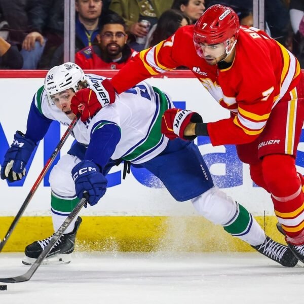Flames stay scorching, beat up on Canucks