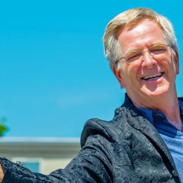 Travel guru Rick Steves is comfortable to pay extra taxes
