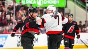 Brady Tkachuk and Jordan Staal battle in the course of the NHL playoffs’ opening faceoff