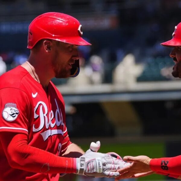 Reds homer 4 instances to clinch collection win over Rockies
