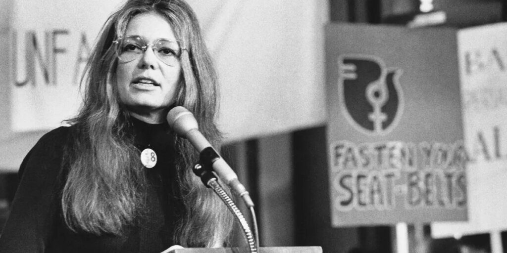 Gloria Steinem opened the door. Now ladies want a seat on the desk.