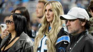 WWE star Charlotte Flair struts into Panthers’ stadium, bangs the drum earlier than recreation vs Lions