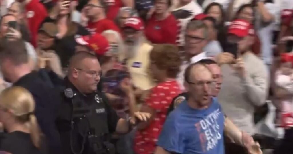 “Really Unattractive” Leftist Gets Clocked After Screaming at Trump at Rally – Trump Calls Supporter “Evander ‘The Real Deal’ Holyfield” – CROWD ROARS! (VIDEO)