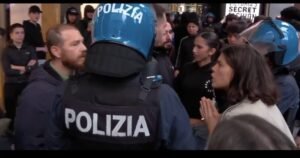 WATCH: Liberal Italian Woman Confronts Police for Being Too Rough with Third-World Migrant Rioters — Seconds Later, an Explosive Device Goes Off